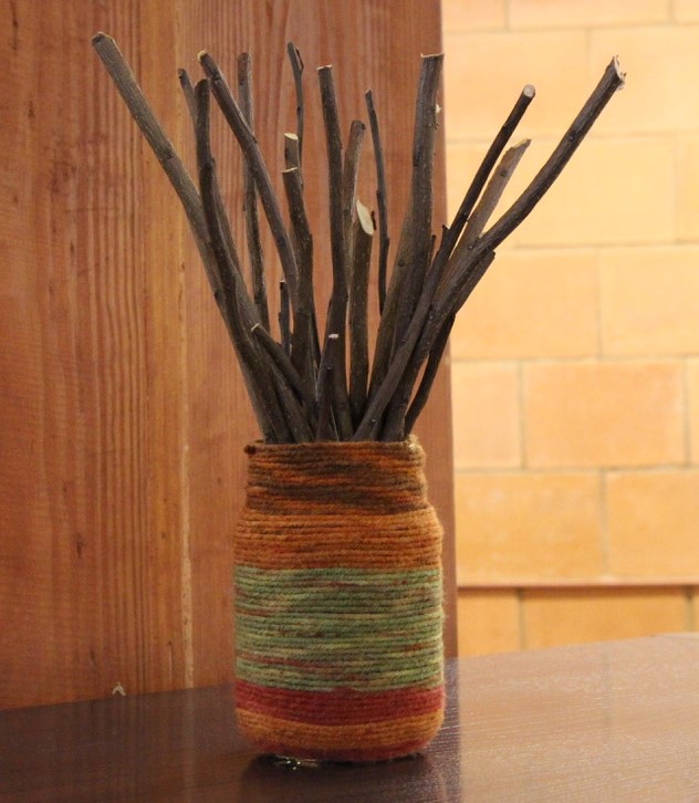 photo of glass jar wrapped in yarn