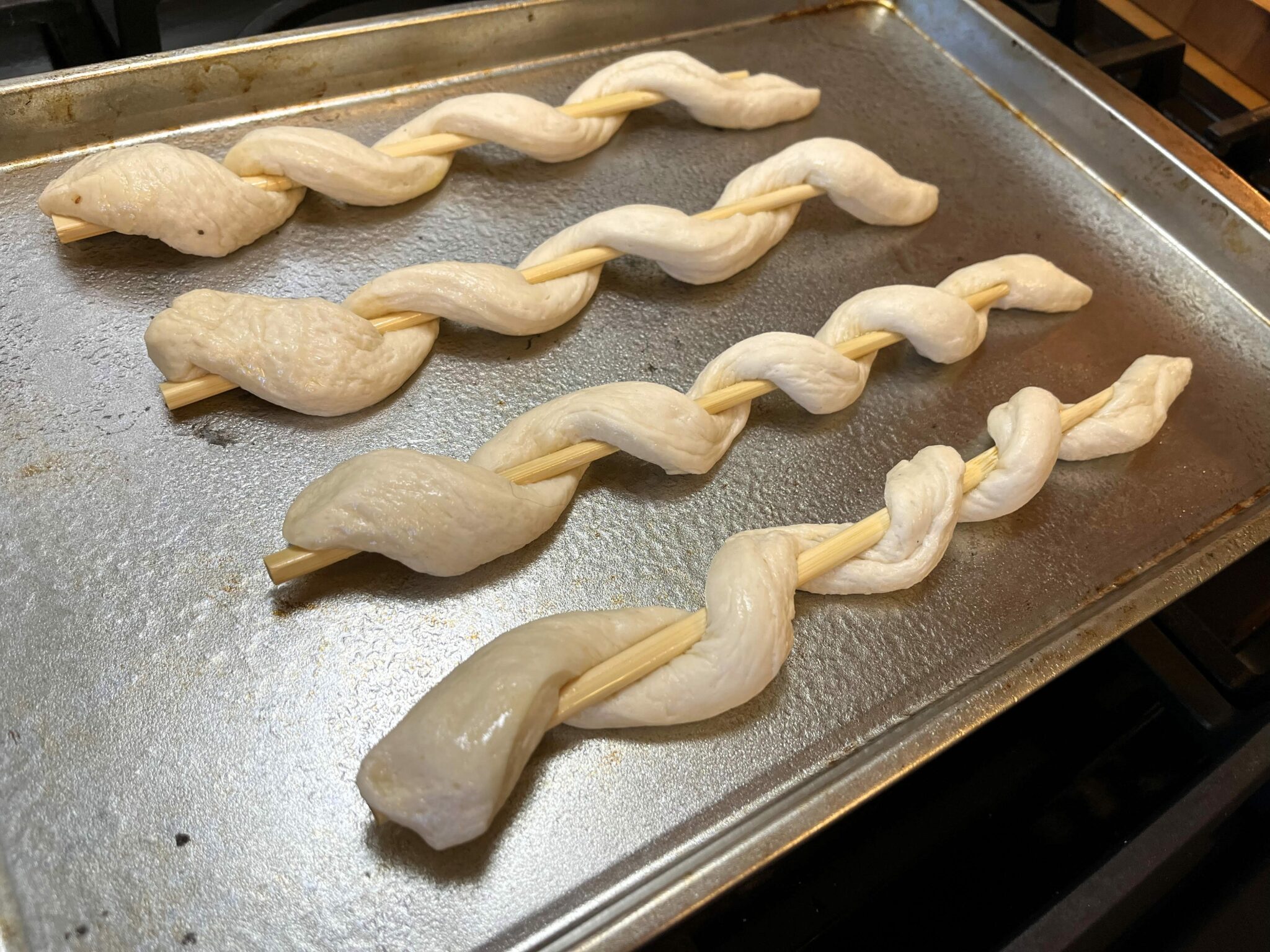 Snake breadstick dough on skewers