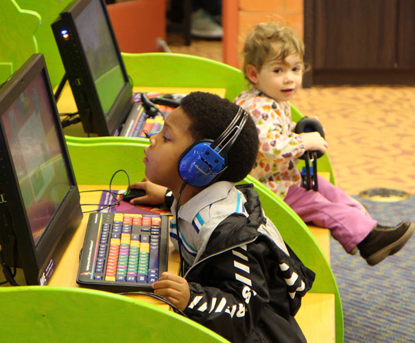 children use computers set up just for them in the children's area at the Columbia Public Library