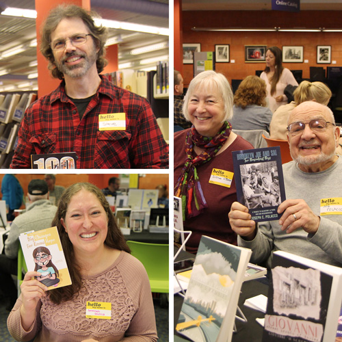 local authors hold up their books while attending the local author fair at the Columbia Public Library