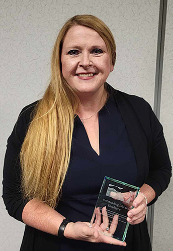 Holts Summit Public Library Lead Pam Stone holds her MLA award