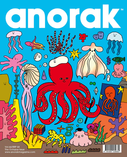 A bright red octopus in a white beret floats in a bright blue sea amongst other sea flora and fauna. He holds a portrait of himself. 