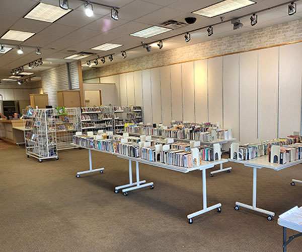 Books on tables inside the temporary Callaway County Public Library location